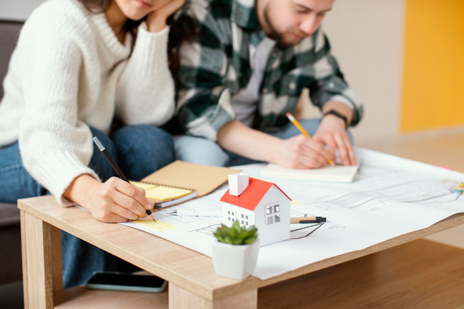 Couple making schedule for home inspection